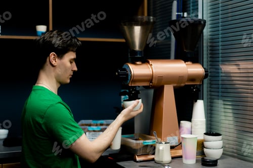 Preview: coffee tester at a coffee factory with roasting freshly ground coffee into cup