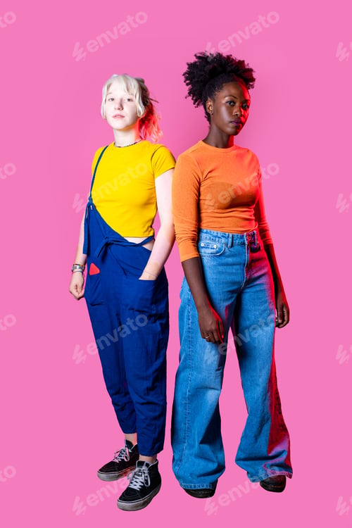 Preview: Two young diverse multicultural caucasian and black women best friends posing isolated background
