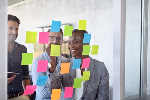 Preview: Business people using post it notes to share ideas