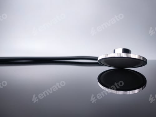 Preview: Closeup stethoscope with reflection on a black acrylic board