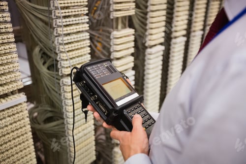 Preview: Technician using digital cable analyzer