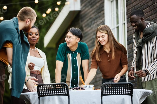 Preview: Diverse Cheerful Friends Setting Table