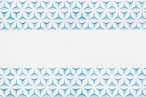 Preview: Abstract geometric background with copyspace. Triangles cut out in paper. White and blue color.