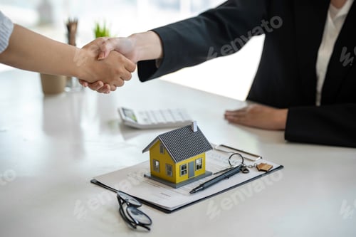 Preview: Successful deal Real estate lease or home purchase concept buyer shakes hands with bank employee aft