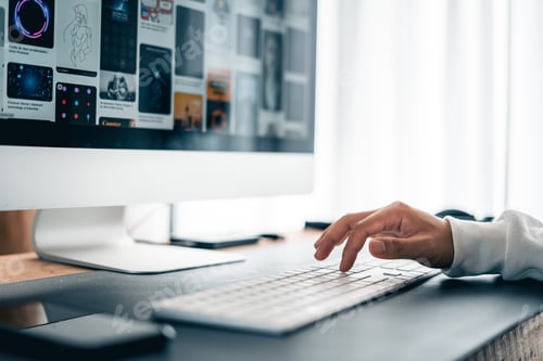 Preview: Man working on computer desk at home office