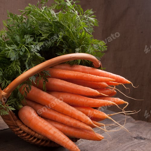 Preview: fresh carrots in wicker basket bunch on grungy wooden background