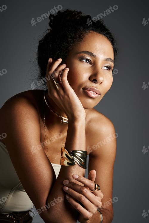 Preview: An elegant African American woman showcases exquisite jewelry in a modern setting