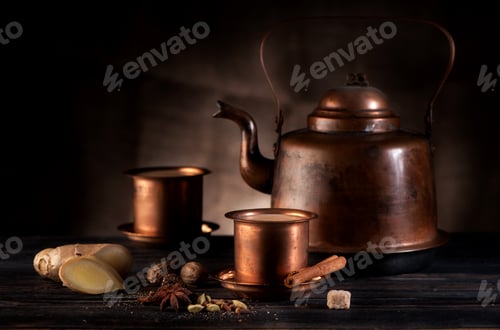 Preview: Tea Kettle with Spices on a Wooden Table