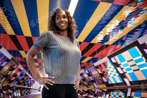 Preview: Portrait of mature black woman in a colorful environment.