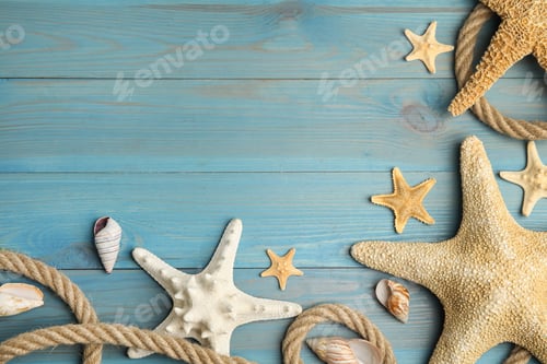 Preview: Beautiful sea stars, shells and rope on blue wooden background, flat lay. Space for text