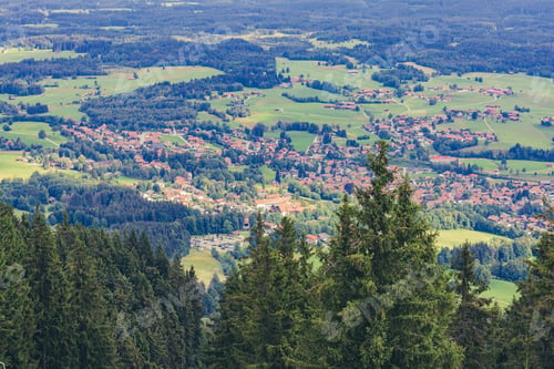Preview: view from the mountain to the village at the foot and the ski lift
