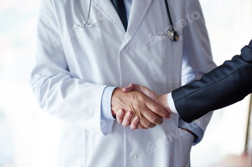 Preview: Doctor Handshake With A Patient At Doctors Bright Modern Office In Hospital
