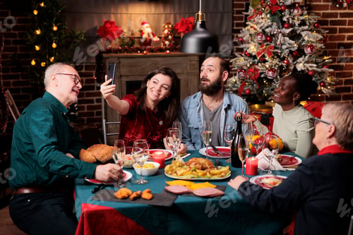 Preview: Persons enjoying photos on christmas eve