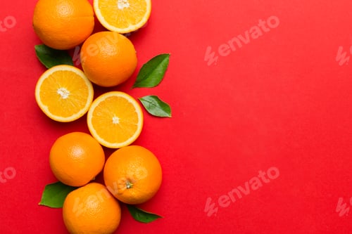Preview: fresh Fruit orange slices on colored background. Top view. Copy Space