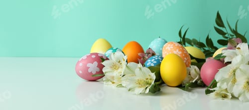 Preview: Color Easter eggs and alstroemeria flowers against mint background