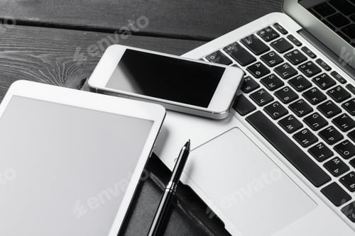 Preview: Open laptop with digital tablet and smartphone close up