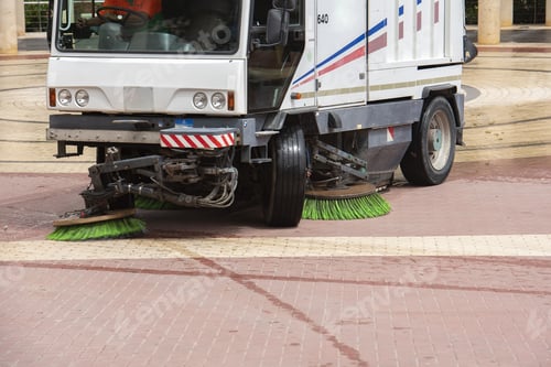 Preview: Sweeper truck picking up trash from the square after a fruit market