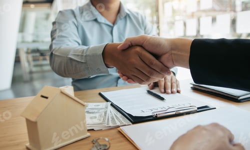 Preview: Home sales agents and buyers work on signing new homes and shaking hands.