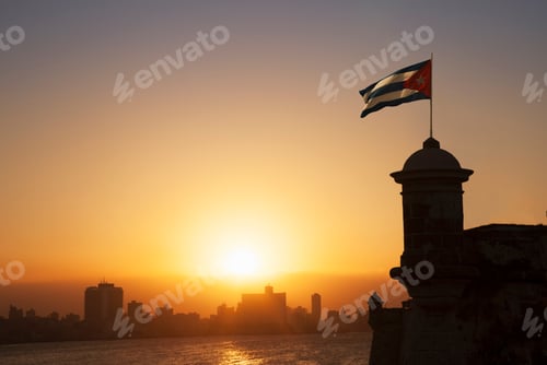 Preview: Cuban flag over the Fortress of El Morro at sunset, Havana, Cuba