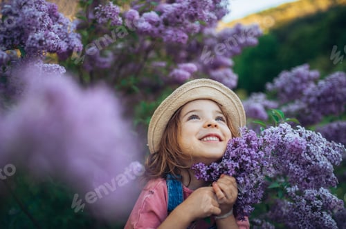 Preview: Portrait of little girl with lilac, spring mood.