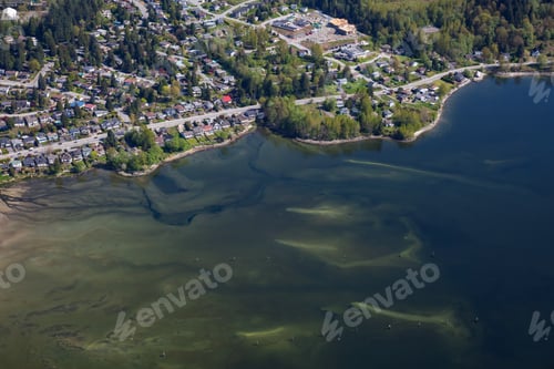 Preview: Aerial picture of a sandy beach in front of luxury homes in a neighborhood of North Vancouver