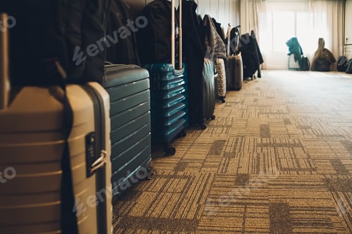 Preview: Travel suitcases lined up in a spacious hotel room of Asian tourists, with copy space.