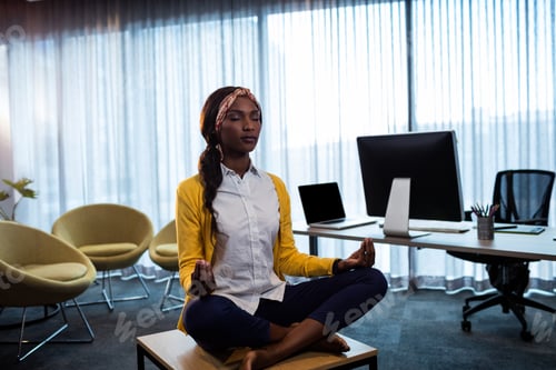 Preview: Businesswoman doing yoga