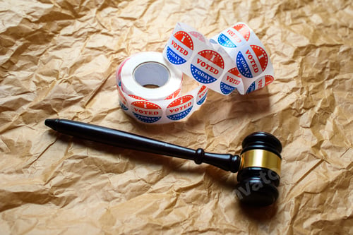 Preview: Concept of disputes during the American elections, with judge gavel in the background.