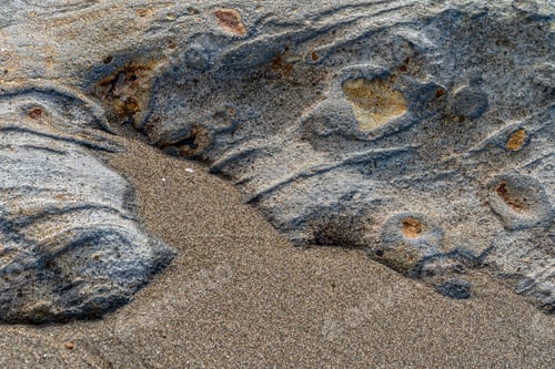 Preview: Rock texture sinking into the sand