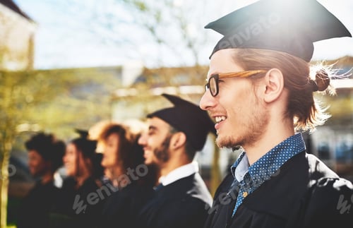 Preview: Shot of a smiling university student on graduation day with classmates in the background
