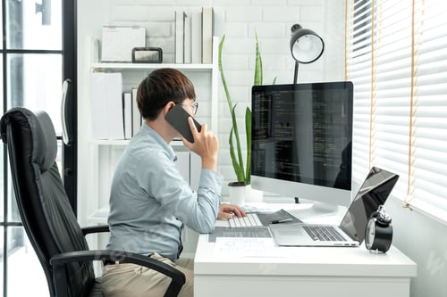 Preview: Male programmer is programming to develop program app and website of corporate while working