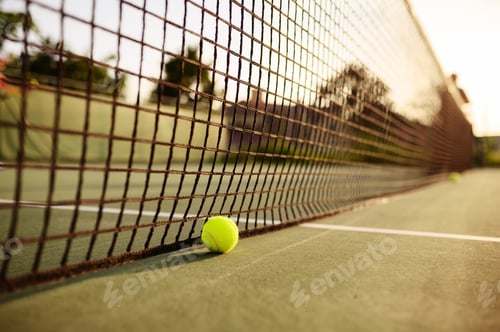 Preview: Big tennis ball at the net, nobody, outdoor court