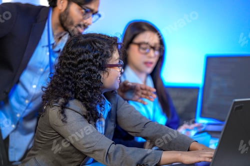 Preview: Senior engineer mentoring a junior female developer.
