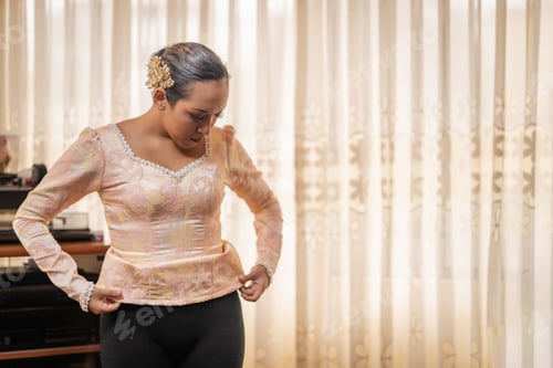 Preview: Dancer woman adjusting her traditional dress before performing