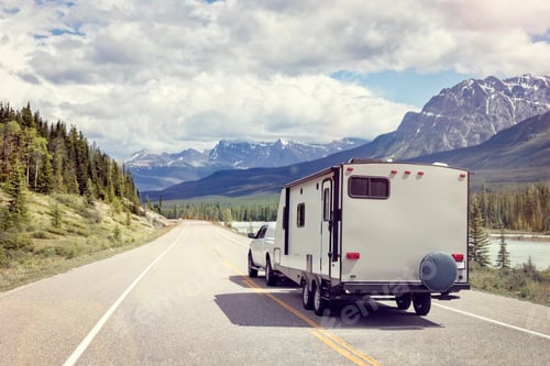 Preview: Caravan or motor home trailer on a mountain road