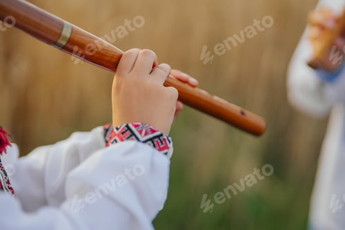 Preview: Hands Of Little Boy Kid Playing On Woodwind Wooden Flute - Ukrainian Sopilka
