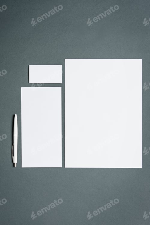Preview: Mock-up business template with cards, papers, pen. Gray background.