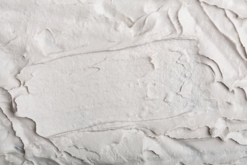 Vista previa: Structural Plaster White On A Black Background. White Cream. Paint Smear. Plasticine