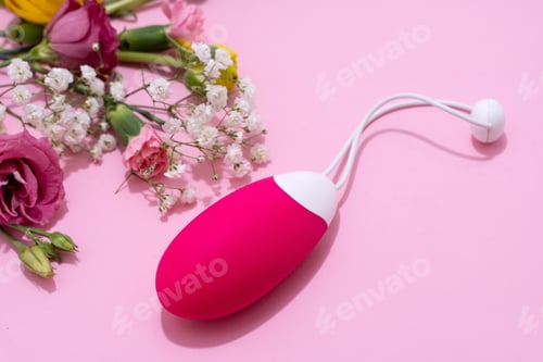 Preview: Vibrator adult toy with delicate flowers on a pink backdrop