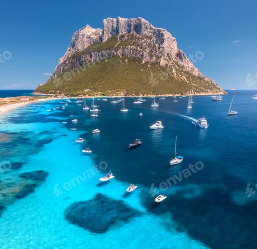 Preview: Aerial view of luxury yachts and boats on blue sea, mountain