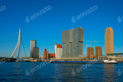 Preview: Rotterdam skyscrapers skyline and Erasmusbrug bridge over of Nieuwe Maas river. Rotterdam