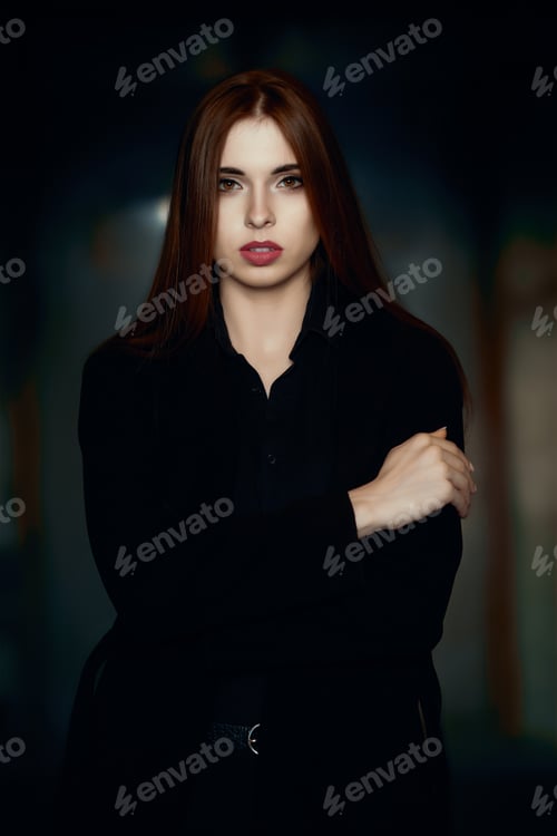 Preview: Low key portrait of beautiful girl with natural make up and red lips