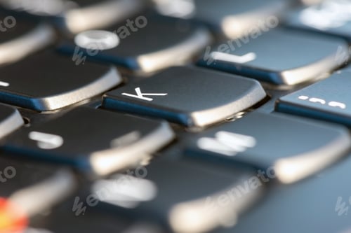 Preview: Macro shot of black keyboard focus on K key