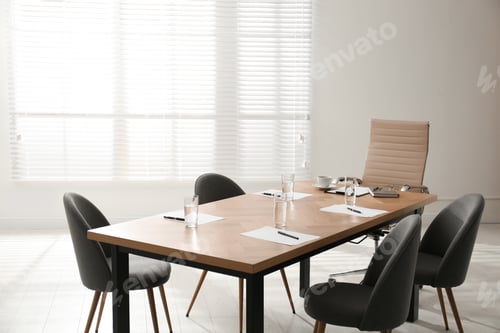 Preview: Simple office interior with large table and chairs