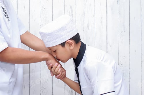 Preview: Muslim Boy Kissing Parent Hand on Eid Mubarak