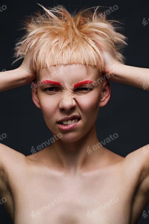 Preview: Close up on face of crazy mad cocky young woman with stylish dyed pink hair, hands ruffle her