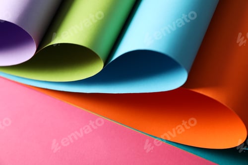 Preview: Color sheets on pink background, close up. Abstract background