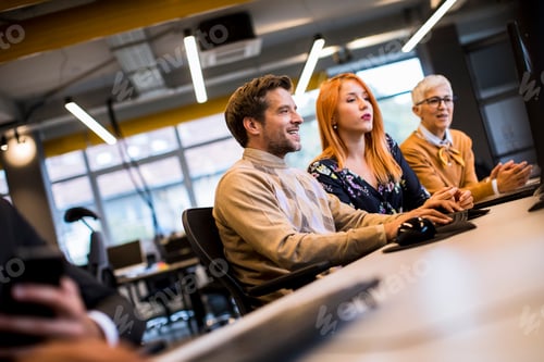 Preview: Group of business people in the modern office