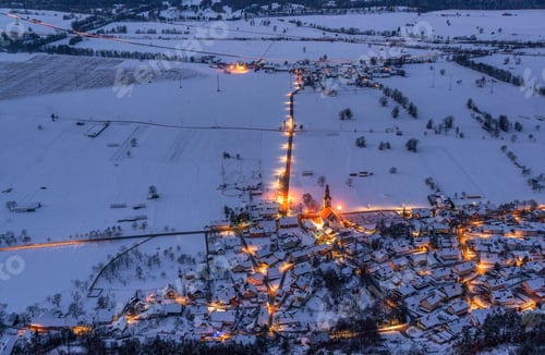 Preview: Villages before the dramatic sunrise, surrounded by mountains.