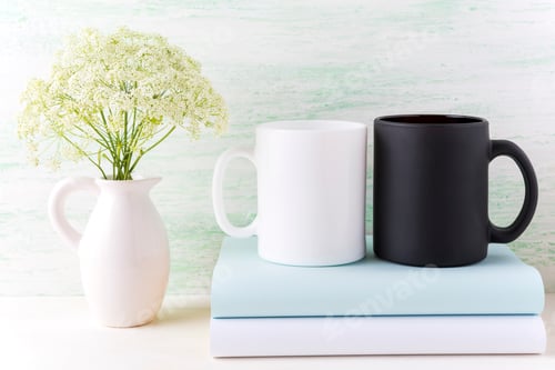 Preview: Black and white mug mockup with books and white flowers